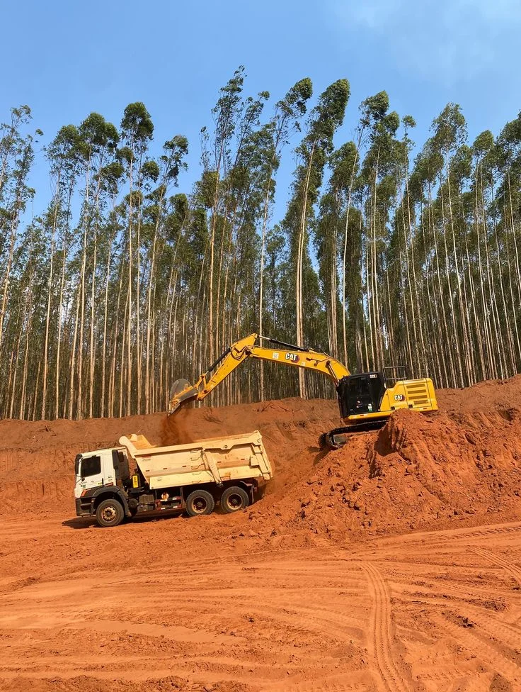 SGT excavator loading a haul truck at a materials site